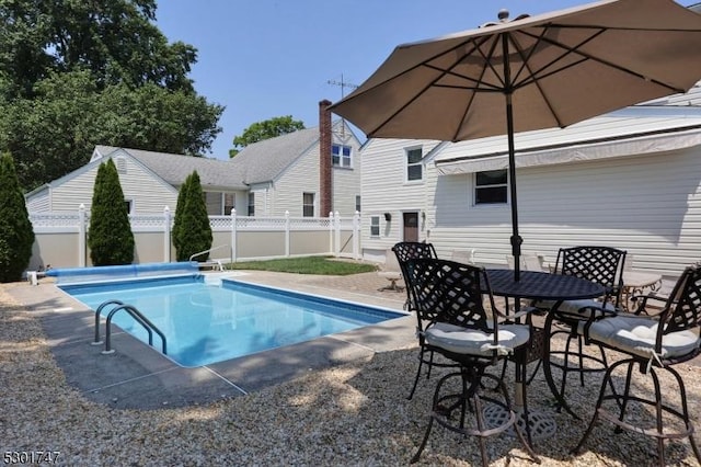 view of pool with a fenced in pool, a fenced backyard, and a patio area