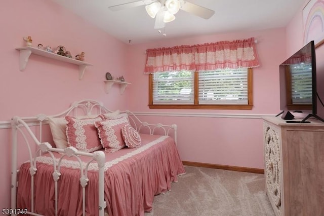 bedroom featuring baseboards, ceiling fan, and carpet floors