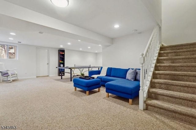 sitting room featuring recessed lighting, baseboards, stairs, and carpet