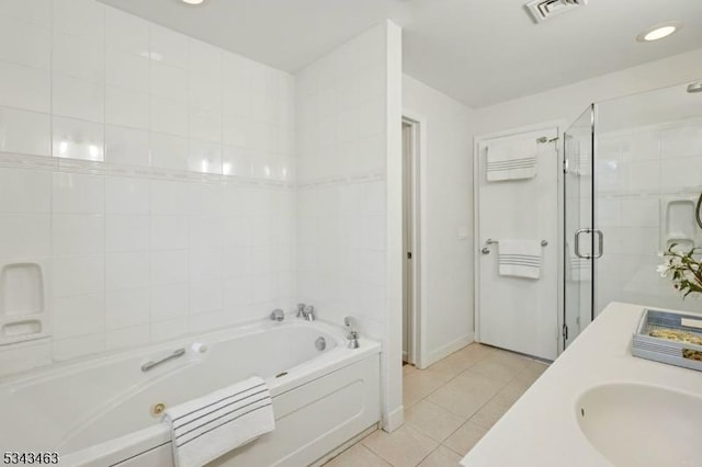 bathroom featuring tile patterned flooring, visible vents, a shower stall, a bath, and a sink