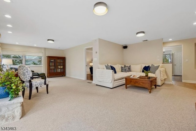 living room featuring light carpet, recessed lighting, and baseboards