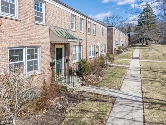 exterior space with brick siding