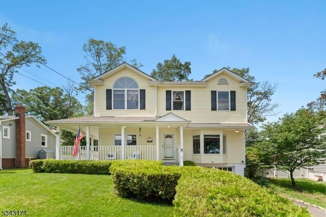 106 Chincopee Ave, Hopatcong Boro, NJ 07843 - view of front facade with a porch and a front lawn