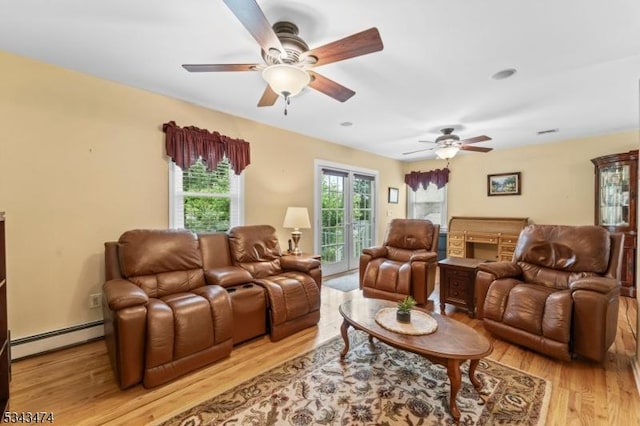 106 Chincopee Ave, Hopatcong Boro, NJ 07843 - living area with baseboard heating, ceiling fan, and light wood-style flooring