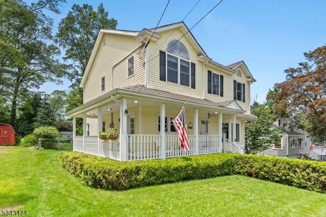 106 Chincopee Ave, Hopatcong Boro, NJ 07843 - view of front of home with covered porch, a storage unit, and a front lawn