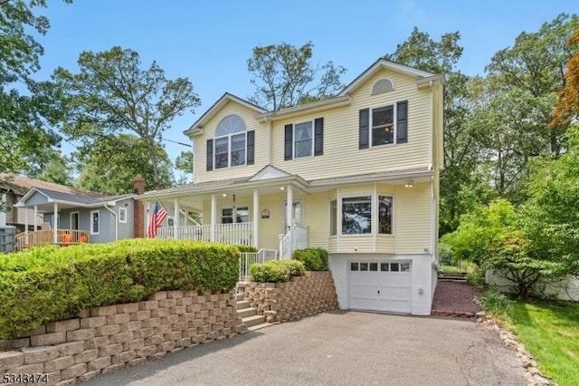 106 Chincopee Ave, Hopatcong Boro, NJ 07843 - traditional home featuring a porch, a garage, driveway, and stairway