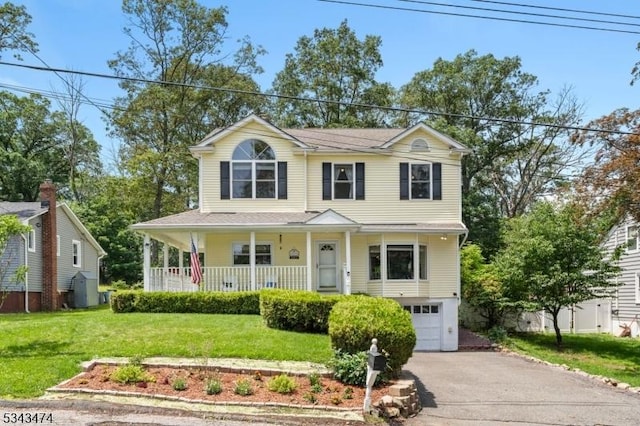 106 Chincopee Ave, Hopatcong Boro, NJ 07843 - view of front of house with asphalt driveway, covered porch, a garage, and a front lawn