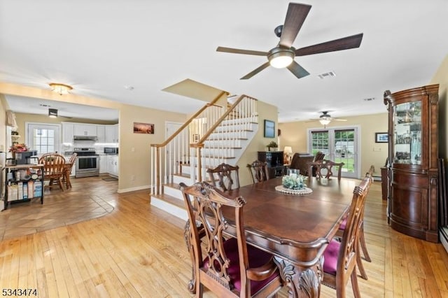 106 Chincopee Ave, Hopatcong Boro, NJ 07843 - dining space featuring stairs, light wood-type flooring, and a ceiling fan