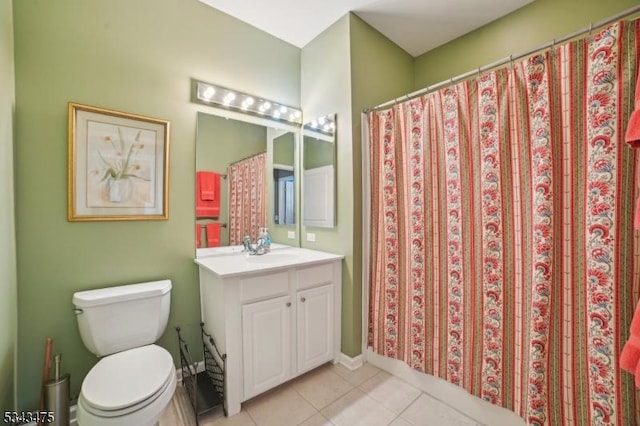 full bathroom featuring tile patterned floors, toilet, and vanity