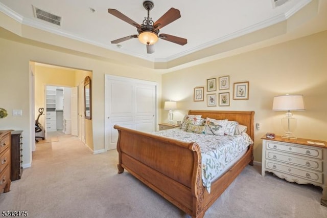 bedroom featuring visible vents, light colored carpet, ornamental molding, and a ceiling fan