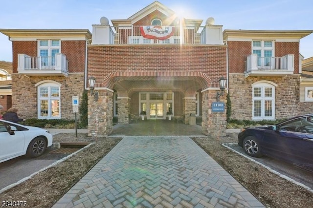 multi unit property with stone siding and brick siding