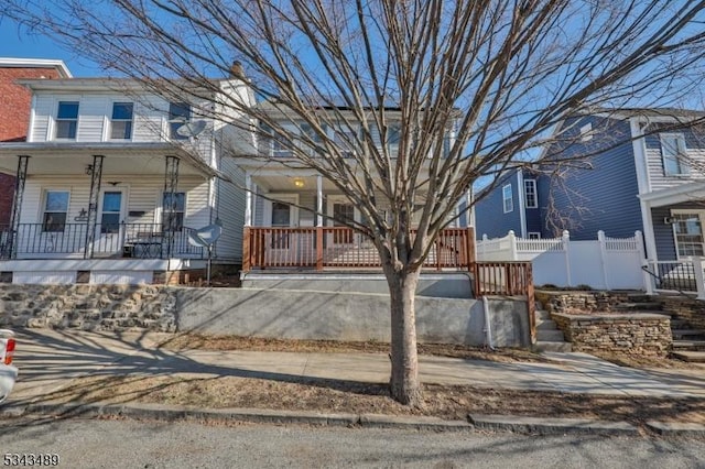 townhome / multi-family property featuring a porch