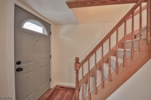 foyer with stairway and wood finished floors