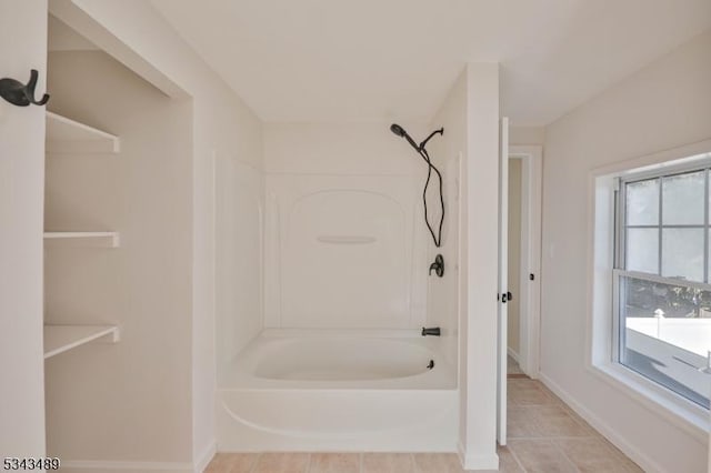 full bath with tile patterned floors, shower / bath combination, and baseboards