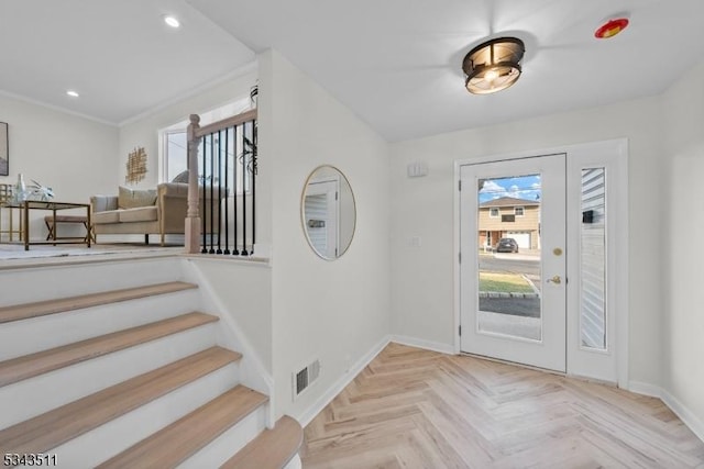 entryway with recessed lighting, visible vents, a healthy amount of sunlight, and baseboards