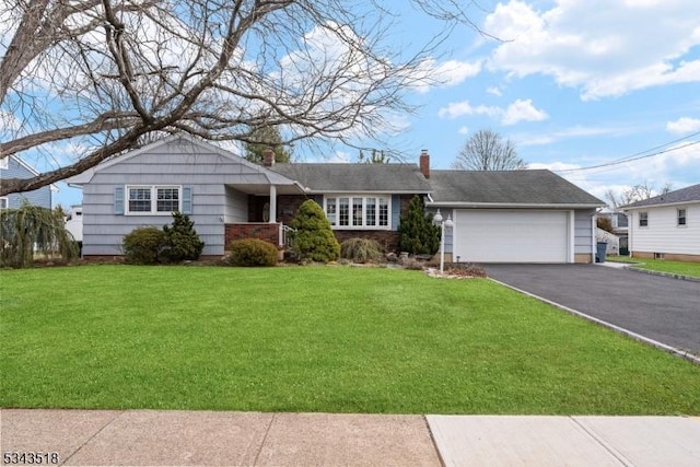 ranch-style house with a chimney, driveway, an attached garage, and a front yard