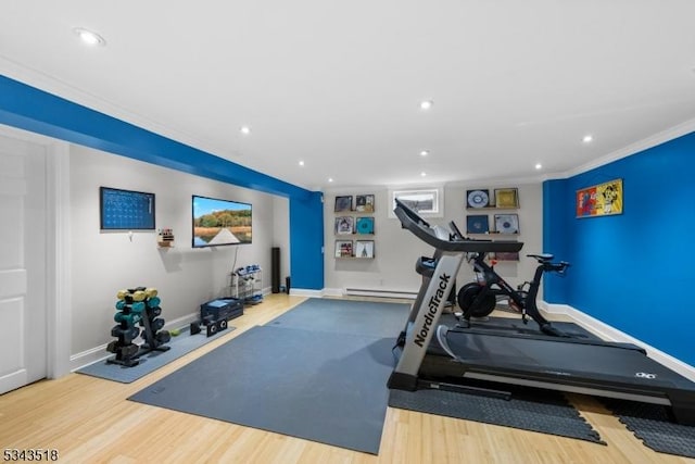 workout area with recessed lighting, baseboards, and wood finished floors