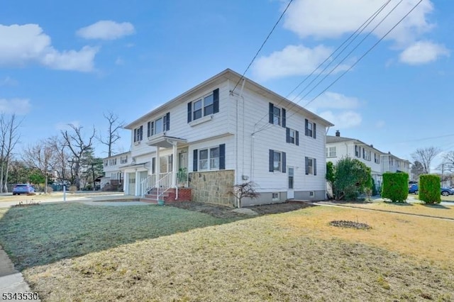 view of property exterior with a lawn