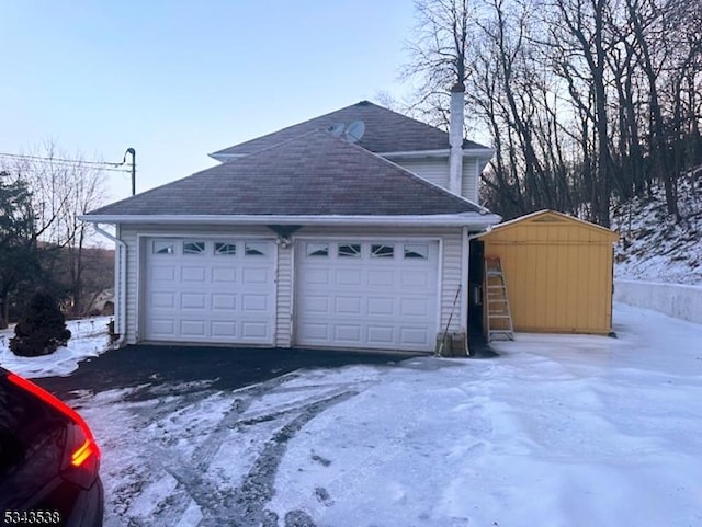 view of snow covered garage