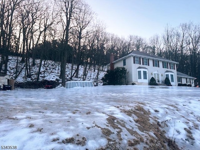 view of front of property featuring a chimney