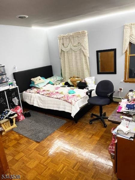 bedroom with visible vents