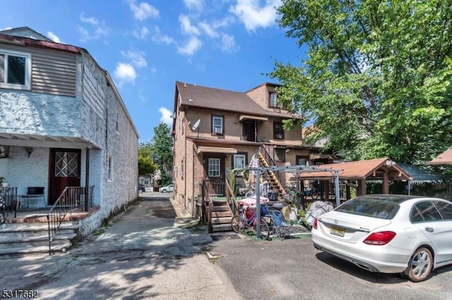 view of front of home with stairs