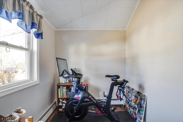 workout room featuring a baseboard radiator and ornamental molding