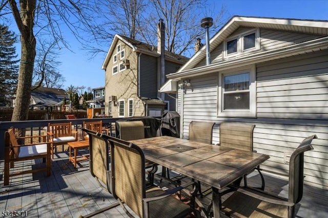 wooden terrace featuring outdoor dining space