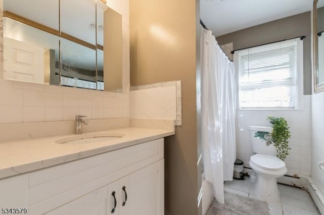 full bathroom with a baseboard heating unit, tile walls, toilet, tile patterned floors, and vanity