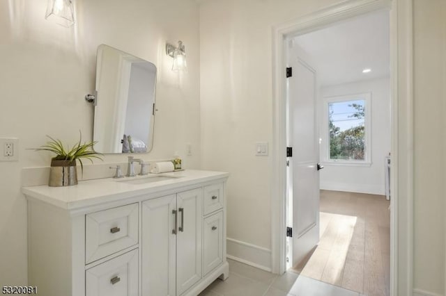 bathroom featuring vanity and baseboards