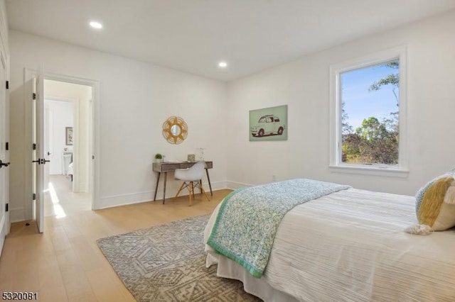 bedroom with recessed lighting, baseboards, and light wood-style floors