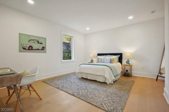 bedroom featuring recessed lighting, baseboards, and wood finished floors