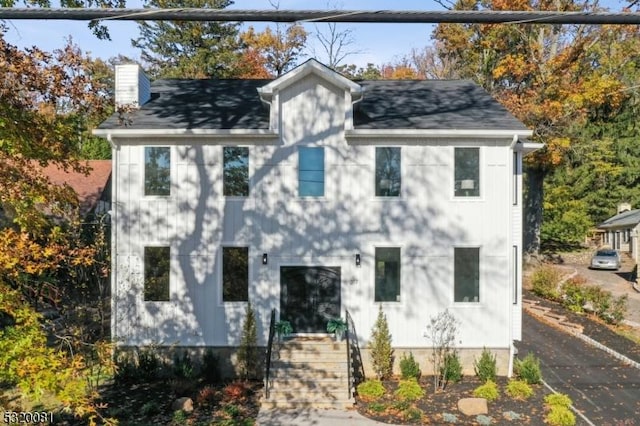 view of front of home with a chimney