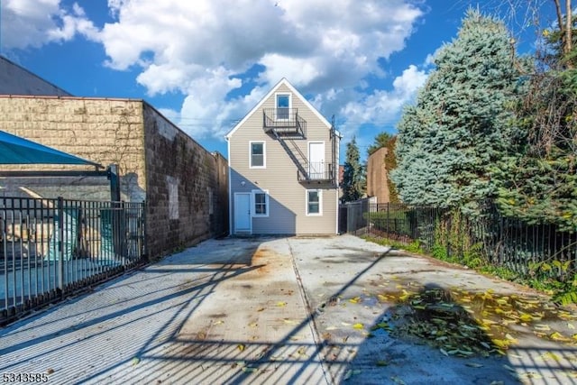 back of property with a patio and fence