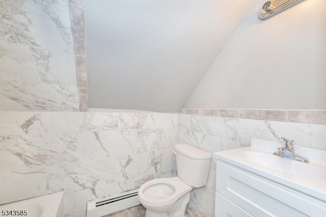 full bath with toilet, a bathing tub, tile walls, baseboard heating, and vanity