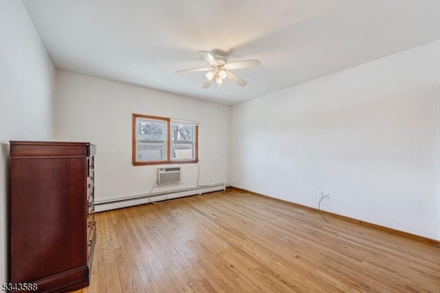 empty room with a baseboard heating unit, baseboards, ceiling fan, light wood-style floors, and a wall mounted AC