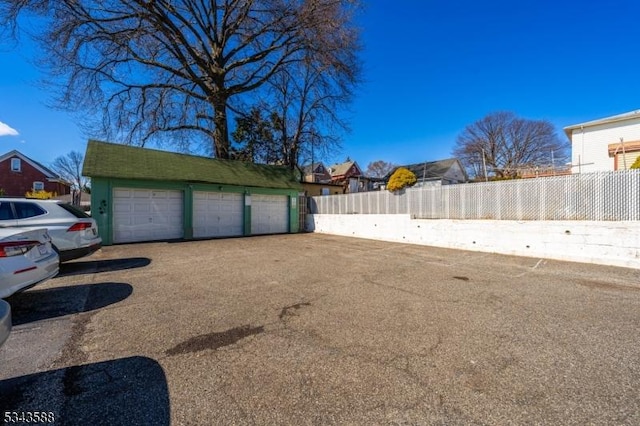 garage with fence