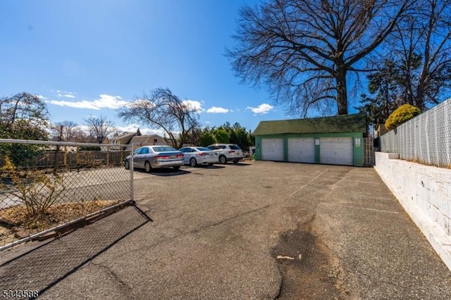 view of car parking featuring fence