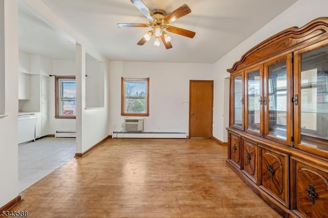 interior space with baseboards, a wall mounted AC, ceiling fan, a baseboard heating unit, and baseboard heating