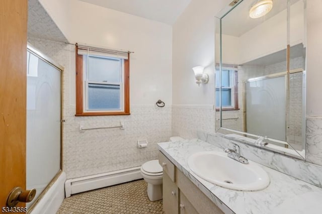 full bathroom featuring a wealth of natural light, tile walls, a baseboard heating unit, and a shower with shower door