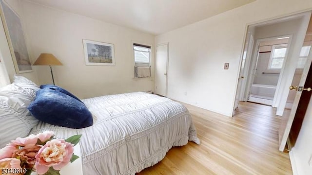 bedroom with light wood-style floors