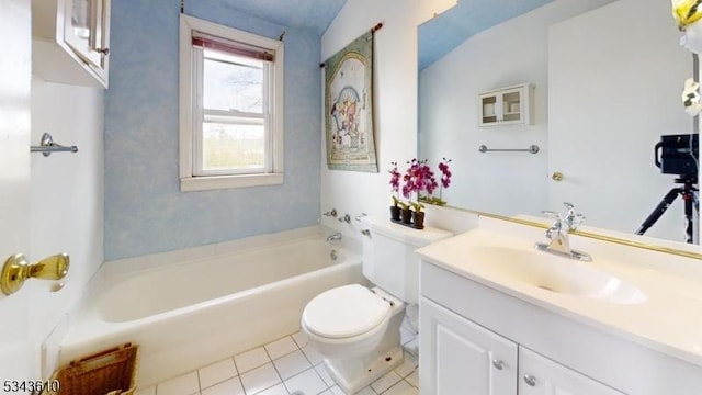 full bathroom featuring a tub, vanity, toilet, and tile patterned floors