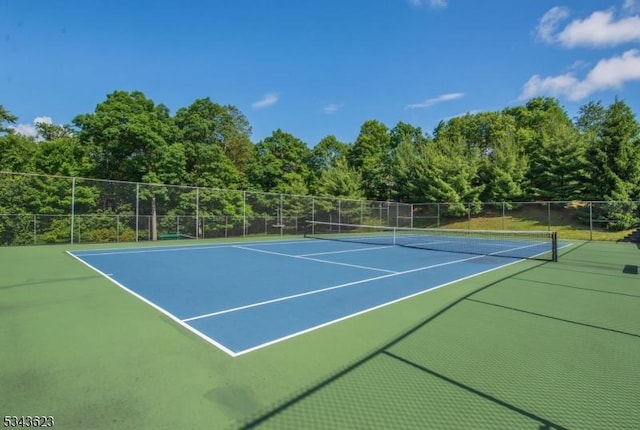 view of sport court featuring community basketball court and fence