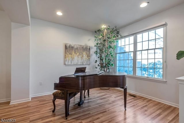 office area with recessed lighting, visible vents, baseboards, and wood finished floors