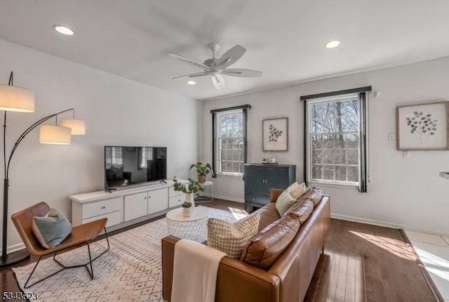 living area with recessed lighting, baseboards, a ceiling fan, and hardwood / wood-style flooring