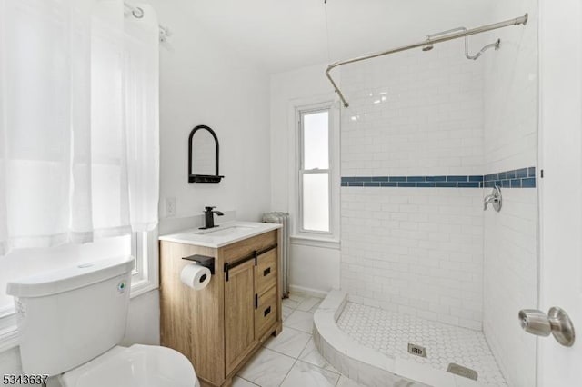 full bath with a shower stall, toilet, and vanity