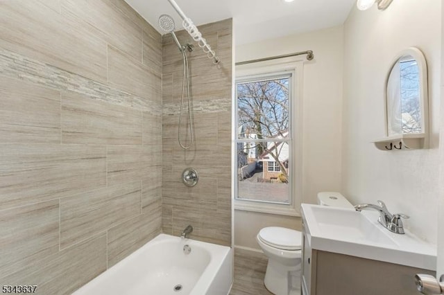 full bathroom featuring toilet, vanity, and shower / tub combination