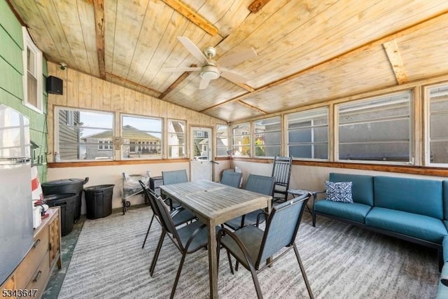 sunroom / solarium with wood ceiling, lofted ceiling, and ceiling fan