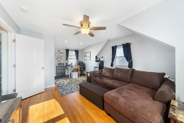 living room featuring recessed lighting, a healthy amount of sunlight, a ceiling fan, and light wood-style floors