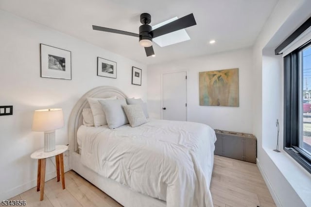 bedroom featuring a ceiling fan, recessed lighting, baseboards, and light wood-type flooring